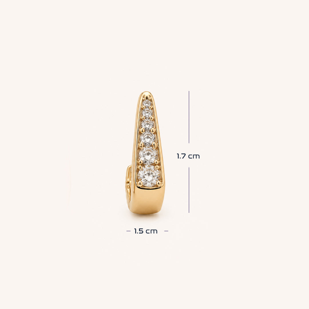 A gold huggie  earring with a vertical channel set with clear round-cut gemstones, shown with dimension.