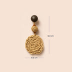 A single statement dangle earring shown on a plain warm beige background with measurement lines and text indicating 6.0 cm width and 6.